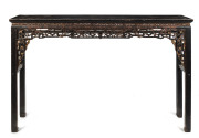A Chinese altar table, carved and lacquered wood, 19th century,