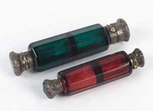 Two double-ended scent bottles, green and ruby glass with silver caps, 19th century,