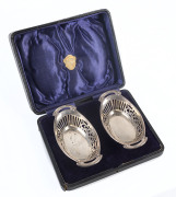 A pair of sterling silver bonbon dishes by Deakin & Francis of Birmingham, 1918, original box bearing label "The Irresistible Antique & Art Shop",