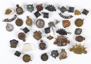 Military badges, buttons, Rising Sun hat and lapel badges, Regiment badges etc, WW1 and WW2 period,