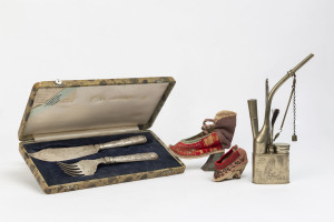 Chinese silver plated fish servers by Zee Sung & Co., opium pipe and two embroidered shoes, 19th and 20th century