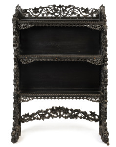 An Anglo-Indian freestanding bookshelf, ornately carved ebony, 19th century