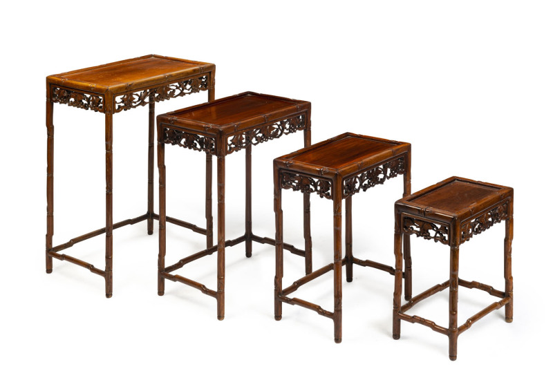 Nest of four Chinese tables, carved wood, 20th century,