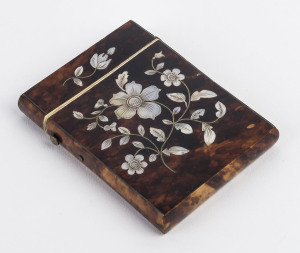 An antique card case, tortoiseshell and ivory with mother of pearl inlay, English, 19th century,