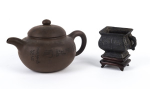 A Chinese bronze teacup on wooden stand; together with a pottery teapot,