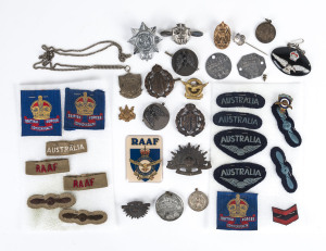 Collection of military badges, patches, medals, dog tags etc