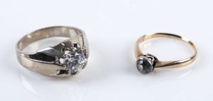Two 14ct gold rings set with a diamond and zirconia,