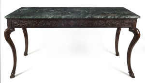 A rare Continental "Game" table, carved walnut with cabriole legs and carved hoof feet and vert marble top, 18th century,