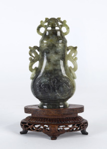 A Chinese carved jade lidded urn on stand, 20th century,