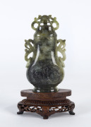 A Chinese carved jade lidded urn on stand, 20th century,