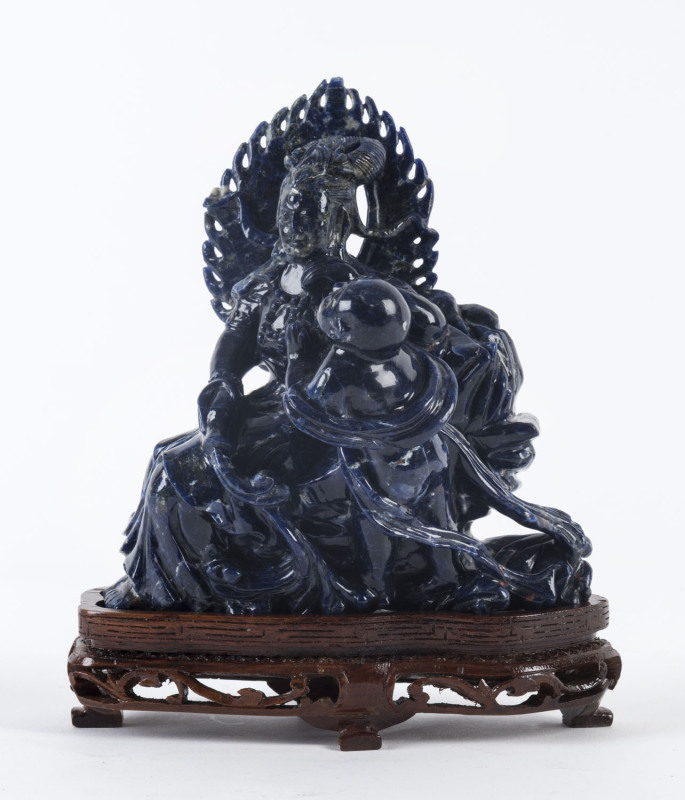 A Chinese carved lapis lazuli seated figure group on stand, 20th century,