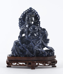 A Chinese carved lapis lazuli seated figure group on stand, 20th century,