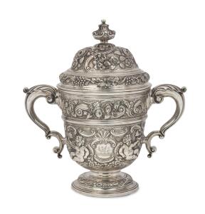 A George II impressive Irish sterling silver two handled cup, mid 18th century, marks visible but hard to read, 31cm high, 29cm across the handles, 2250 grams