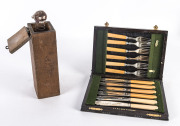 Homemade Jack-in-the-box and boxed fish cutlery, early 20th century