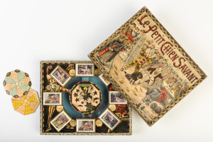 CHILDREN'S GAMES: Le Petit Chien Savant (The wise little dog) circa 1880s boxed game by Leon Saussine, Paris together with a "Puzzle Drive" with Anchor Stone Puzzles - No.14; with ten terra cotta stone pieces in original box with illustrated manual. circa 1910.