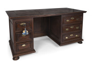 An 18th century French walnut twin pedestal desk,