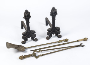 Pair of cast iron fire dogs and brass fire tools (3), 19th century