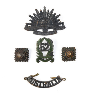 Four 52nd Battalion (The Gippsland Regiment) brass and enamel collar badges (1930 to 1942); three Rising Sun general service badges plus two "AUSTRALIA" badges and eight shoulder badges