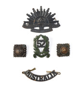 Four 52nd Battalion (The Gippsland Regiment) brass and enamel collar badges (1930 to 1942); three Rising Sun general service badges plus two "AUSTRALIA" badges and eight shoulder badges