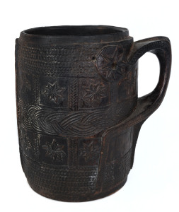 A Tibetan milk jug, carved wood, 19th century, 29cm high