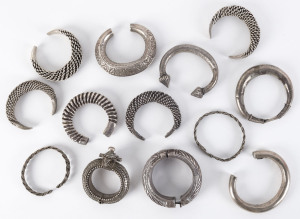 Thirteen Hmong and South East Asian silver bracelets and anklets, 19th/20th century, 820 grams total