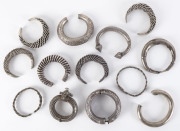 Thirteen Hmong and South East Asian silver bracelets and anklets, 19th/20th century, 820 grams total