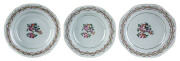 Three 18th century Chinese export ware dishes with famille rose decoration in the English style, Qinalong period, ​22cm diameter
