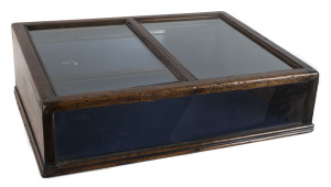 An Australian benchtop display cabinet, cedar with mirror back, 19th century, 23cm high, 76cm wide, 56cm deep