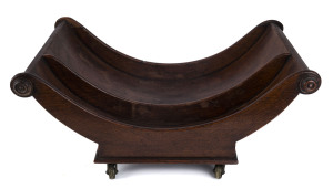 A Regency English cheese wheel, oak with brass casters, early 19th century, 23cm high, 52cm wide, 32cm deep