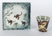 JOHN PERCIVAL & NEIL DOUGLAS: Handpainted tile by Neil Douglas, signed "N.D." 15 x 15cm; together with an Arthur Merric Boyd pottery beaker decorated by John Percival signed "J.P. & A.M.B.", 7.5cm high ​
