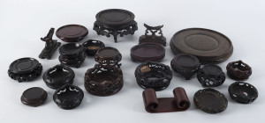 Collection of 22 Chinese carved wooden stands, 19th and 20th century, various sizes
