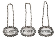 Set of three Georgian sterling silver decanter label by John Robins, London, circa 1809, ​ 5.5cm across, 75 grams total