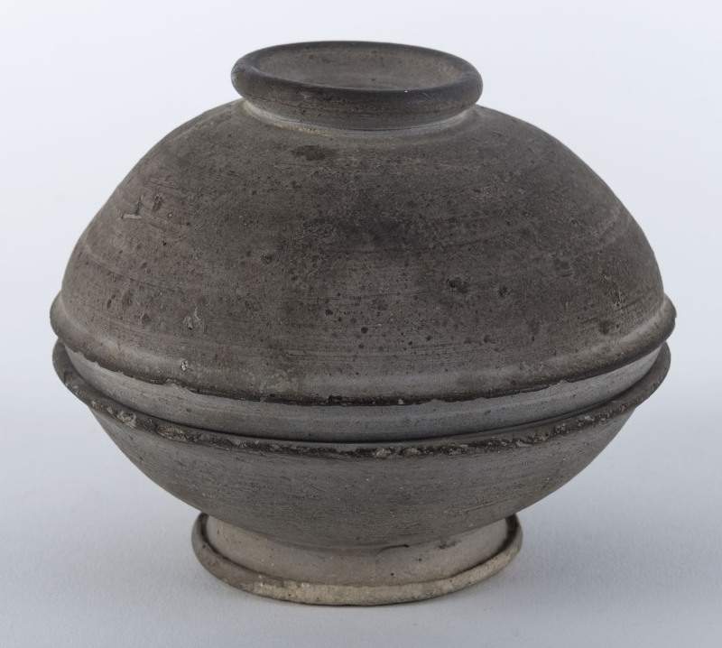 A Korean stoneware lidded bowl, Silla period, 7th century, ​12cm diameter