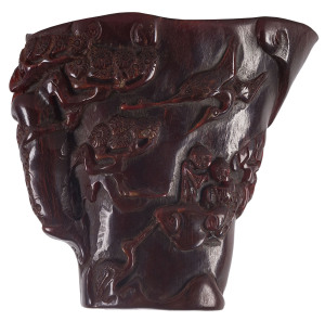 A Chinese carved horn libation cup, 20th century, ​8.5cm high