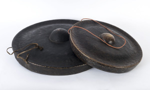 Two bronze Chinese gongs, 19th/20th century, the larger 55cm diameter