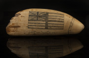 An impressive scrimshaw whale's tooth with flag and whaling scene engraved "Greasy Luck To Whalers Sperm Whaling Off Van Diemen's Land, 1841", 20cm long