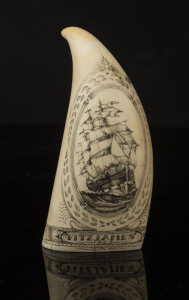 A scrimshaw whale's tooth with ship portrait "Fitzjames, 1902", signed Tonkin, 12cm high