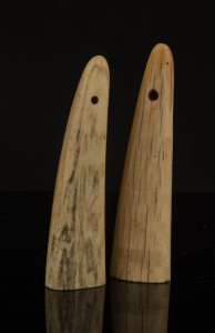 Two walrus tusk pendants, North American origin, 19th century, ​15.5cm and 16.5cm high