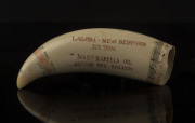 A scrimshaw whale's tooth engraved "Lagona - New Bedford, 371 ton, 31,409 Barrels Oil, 267058 Pds. Baleen", ​13cm long - 2