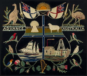 A REMARKABLE AUSTRALIAN COAT-OF-ARMS FROM CHARTERS TOWERS, circa 1880, Large framed Australian coat-of-arms, worked in wool by William Duncan of Charters Towers. Original gilt frame, 71 x 78cm overall The four quadrants of the shield (bale of wheat, merino sheep, 3-masted sailing ship & gold minehead) are surrounded by Australian birds sitting amongst a Scottish thistle, an English rose and an Irish shamrock with a kangaroo at left and an emu at right supporting two white ensigns with a rising