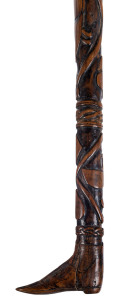 An Australian walking stick carved with kangaroo and emu entwined within an intricate woven and spiral design, handle in the form of a boot, 19th century, 93cm long