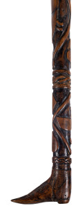 An Australian walking stick carved with kangaroo and emu entwined within an intricate woven and spiral design, handle in the form of a boot, 19th century, ​93cm long