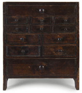 An unusual primitive folk art miniature chest of drawers, stained pine, late 19th century, 36cm high