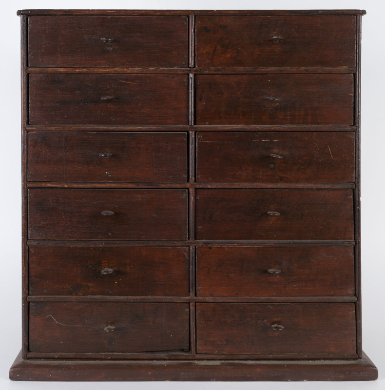 A miniature chest of twelve drawers, cedar and pine with mahogany stain, 19th/20th century, 48cm high