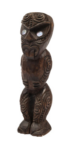 A Maori Tiki statue, carved wood and paua shell, early 20th century, ​20cm high