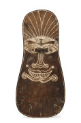A Massim shield, carved wood and fibre with natural earth pigment, Papua New Guinea, 19th/20th century, 61cm high