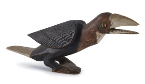 A bird canoe prow, painted wood and shell, Papua New Guinea, early 20th century, 43cm long