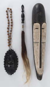 Papua New Guinea mask, necklace, cassowary feather bag and fly whisk, 20th century, the mask 60cm high