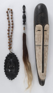 Papua New Guinea mask, necklace, cassowary feather bag and fly whisk, 20th century, ​the mask 60cm high