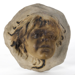 WILLIAM RICKETTS Pottery face plaque, incised "Tikal Pitjantjatjara Tribe Wm Ricketts",22cm high